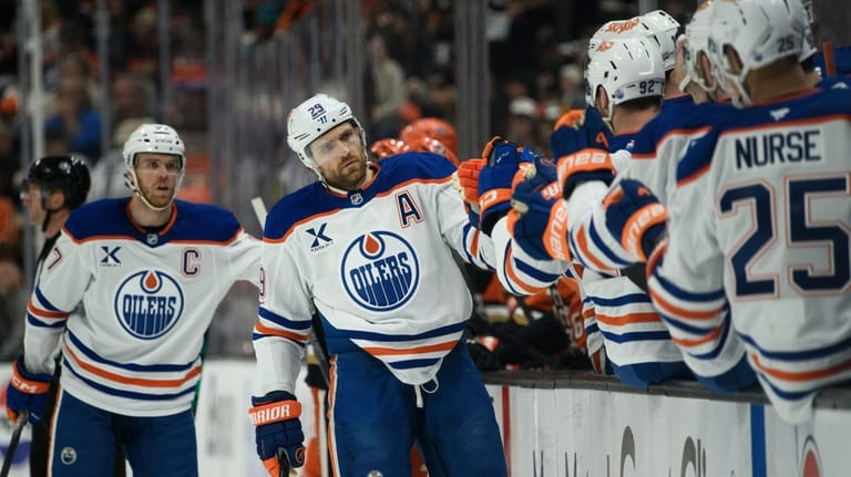 Edmonton Oilers center Leon Draisaitl celebrates a goal by center...