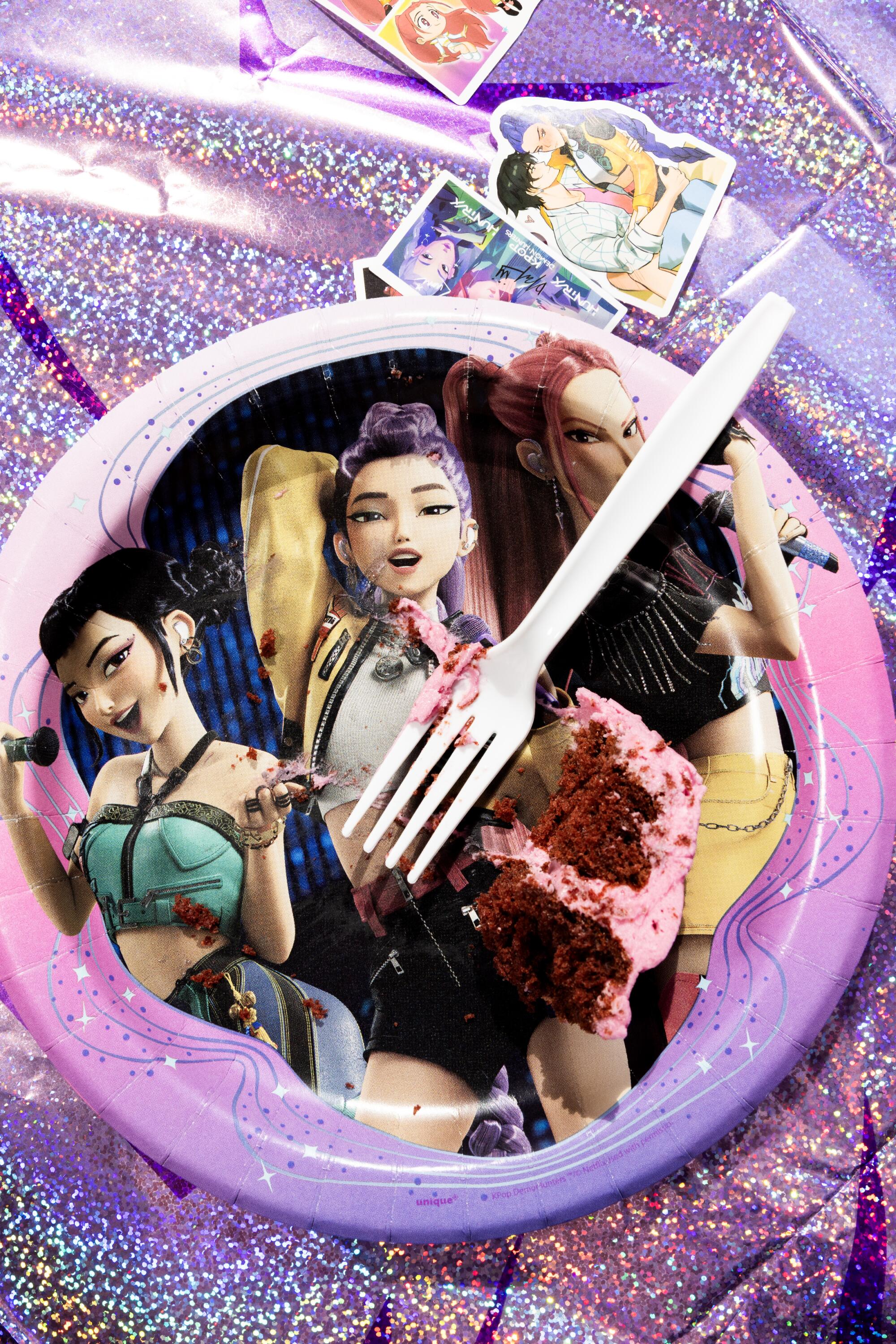 A "KPop Demon Hunters" themed plate and cake.