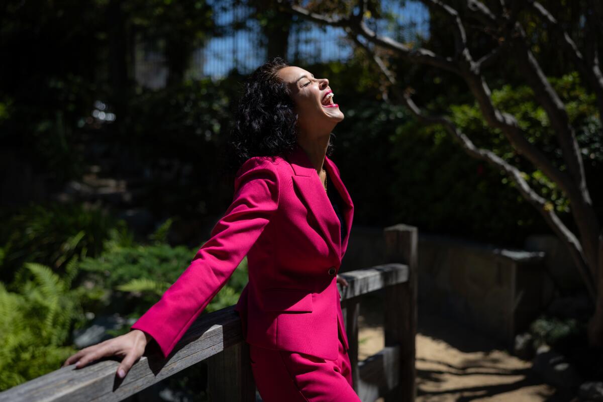 A woman laughs.