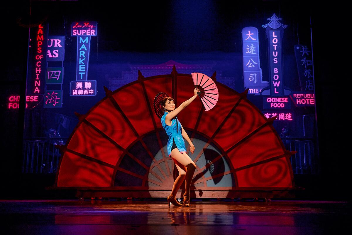 A woman dances onstage.