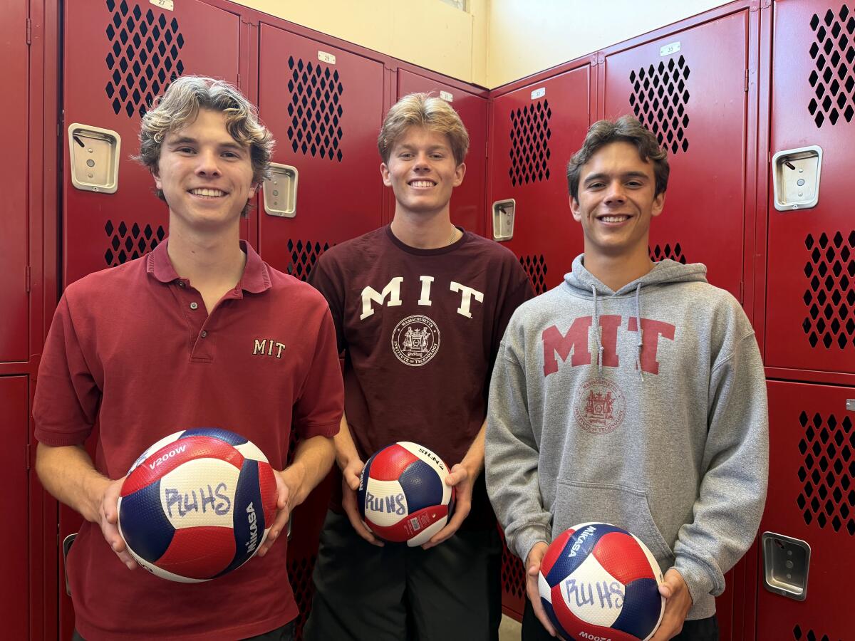 Redondo Union High volleyball players (from left) Tommy Spalding, Vaughan Flaherty and Carter Mirabal pose for a photo.