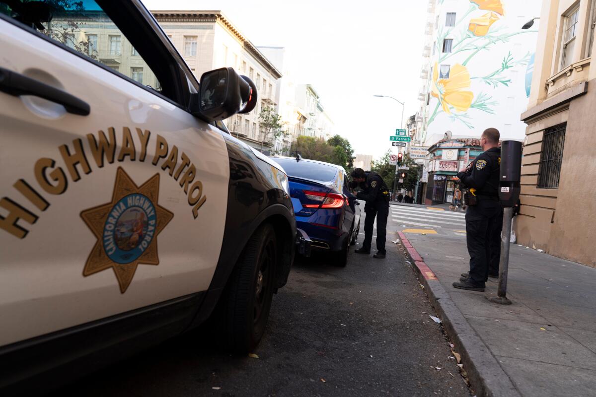California Highway Patrol officers conduct a traffic stop in San Francisco. 
