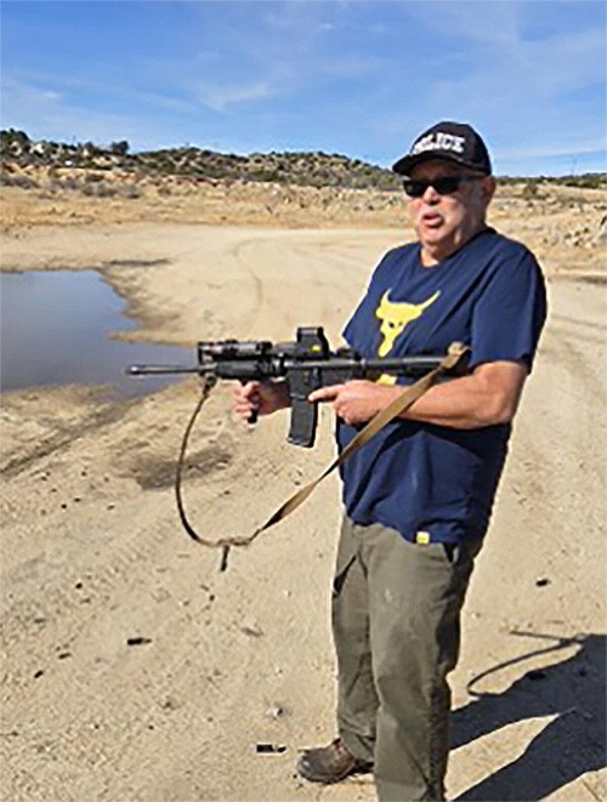 A man holds a gun.