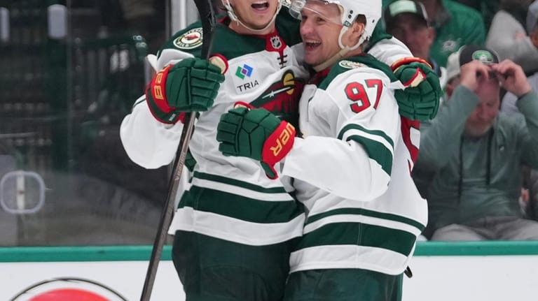 Minnesota Wild left wing Matt Boldy, left, celebrates his second...