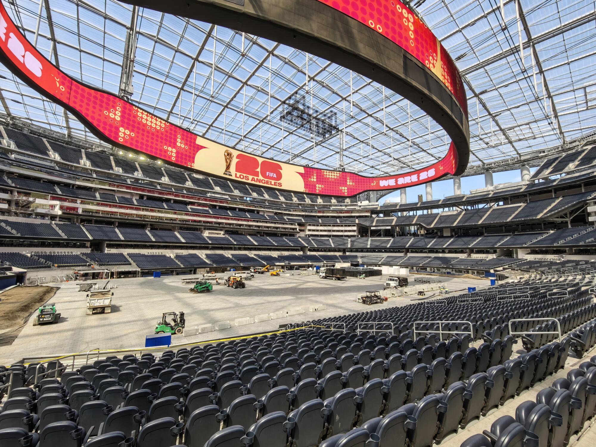 Workers are getting SoFi Stadium ready to host World Cup matches this summer.