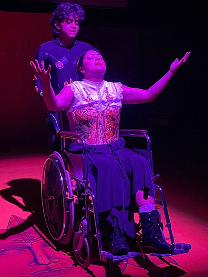 A man pushes a woman on wheelchair.