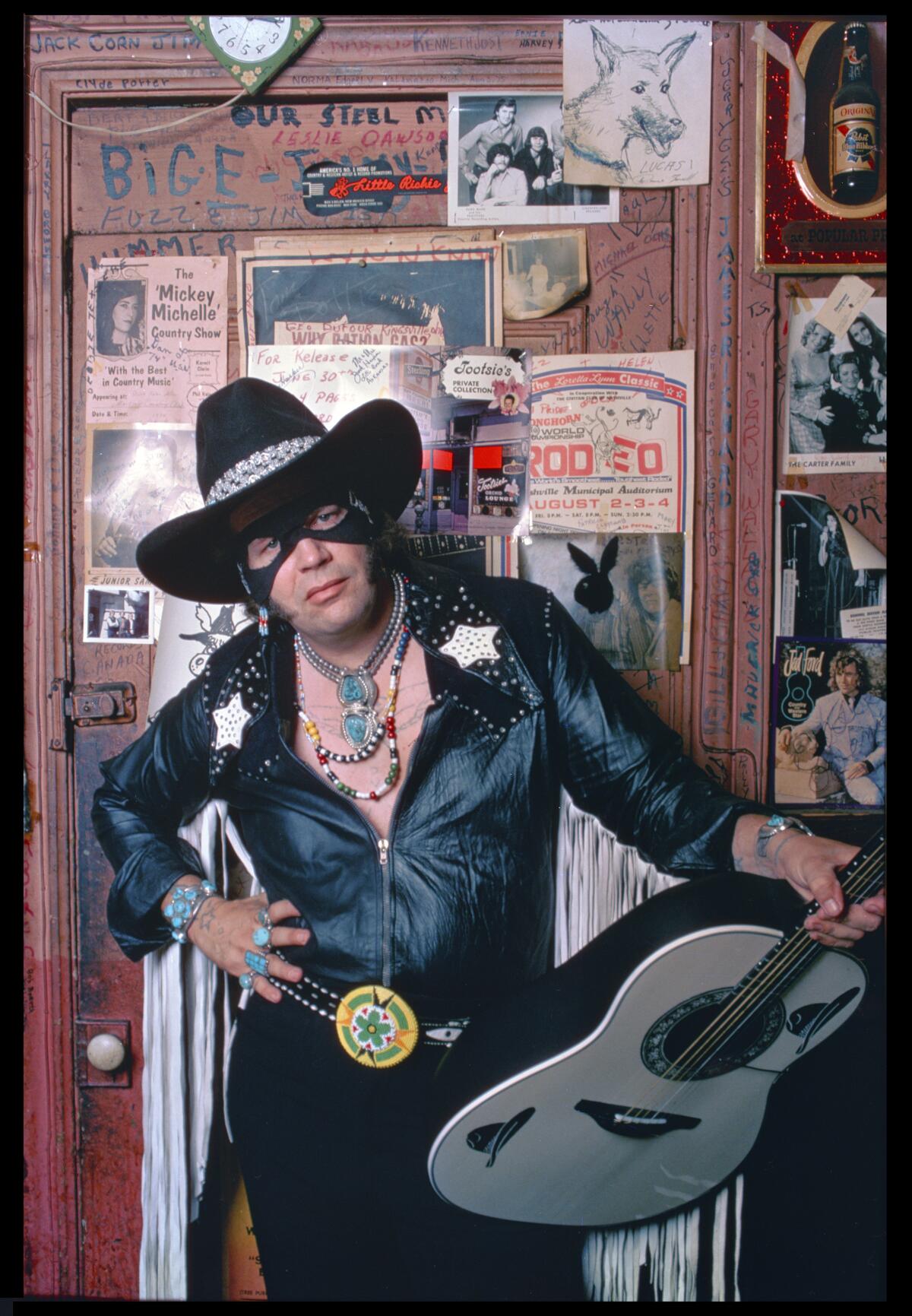 David Allan Coe with guitar dressed as The Mysterious Rhinestone Cowboy in August 1975.