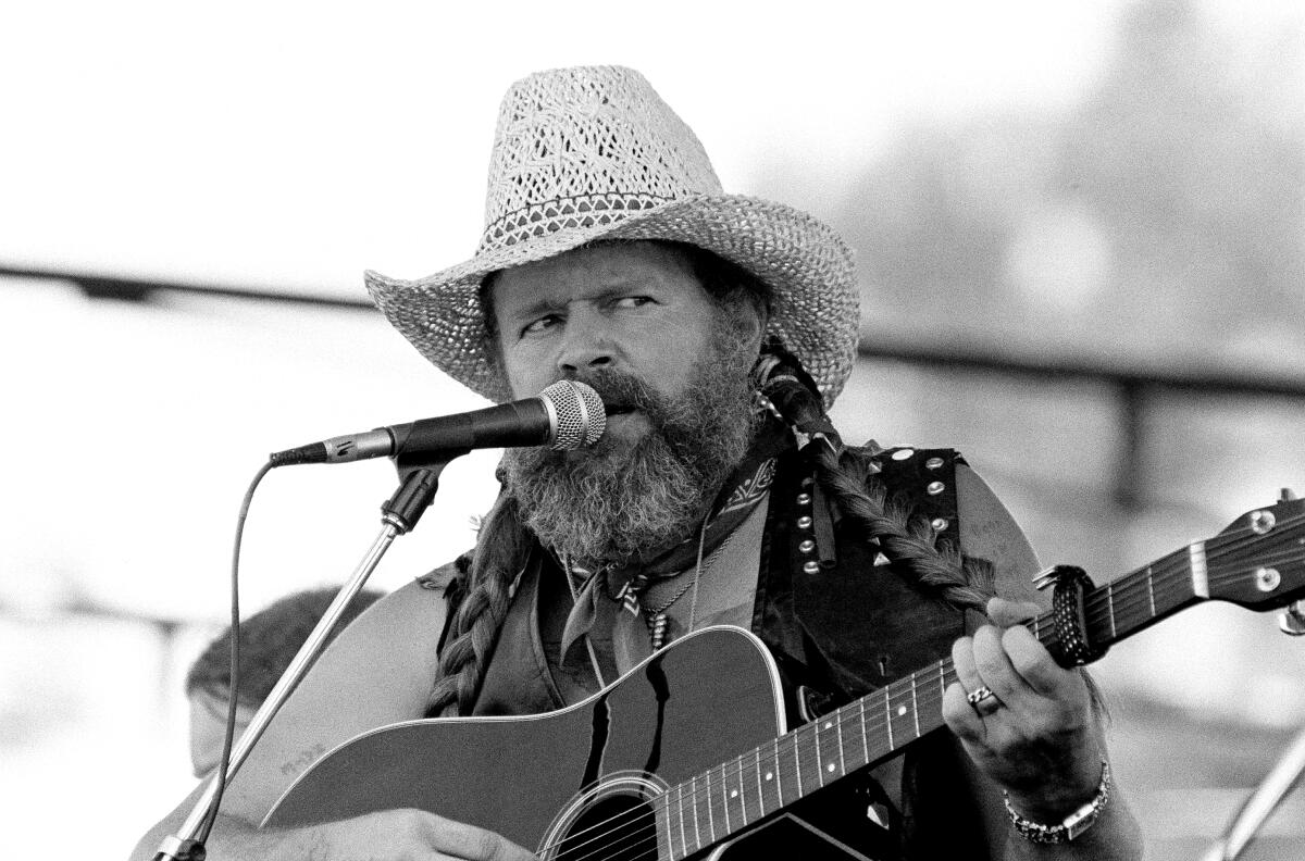 David Allan Coe, sporting Willie Nelson braids, performs at the Willie Nelson July 4th Picnic