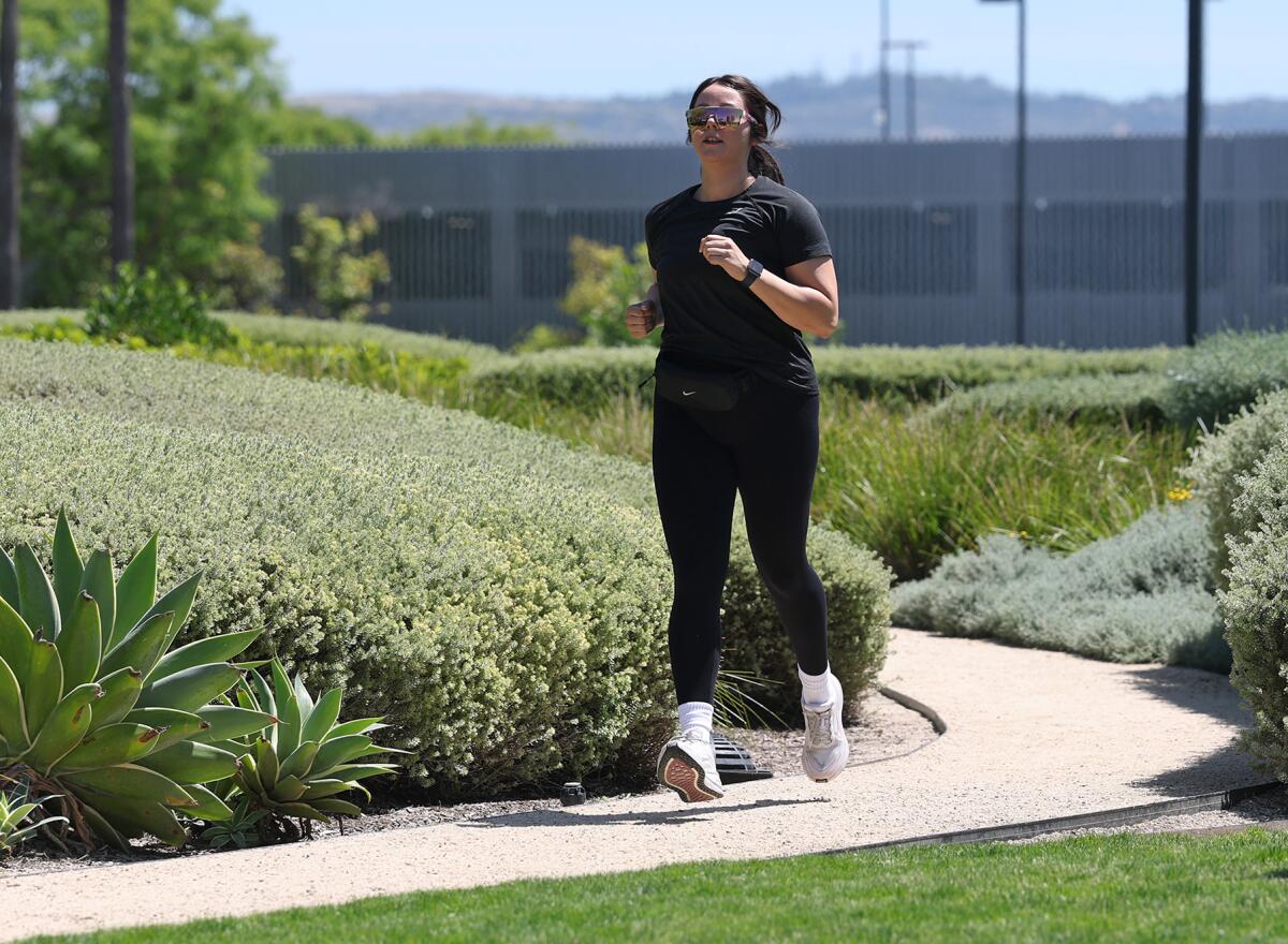 Arlene Garcia goes for a run at a park near her Jones Day law firm in Irvine.