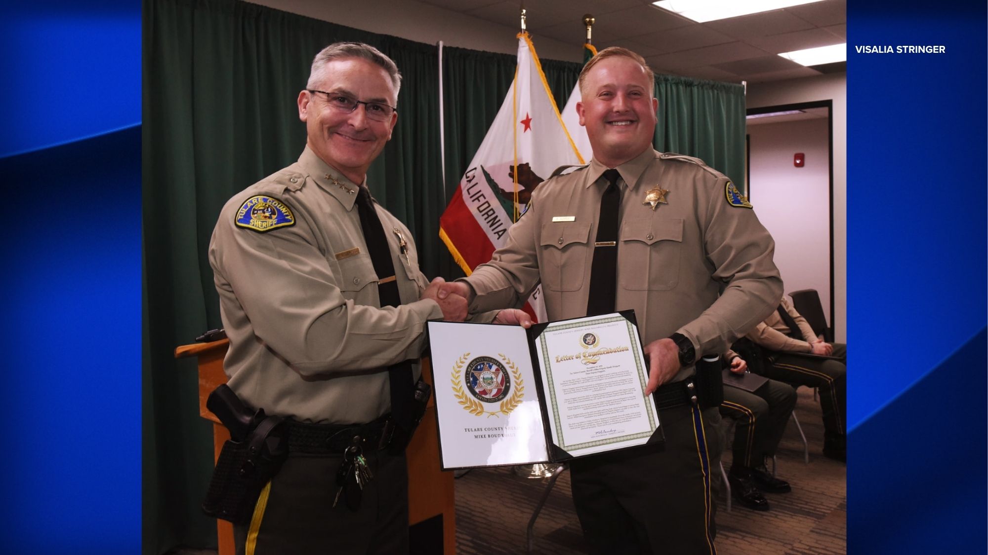 FILE - Tulare County Sheriff Mike Boudreaux, left, with Randy Hoppert, right, the the deputy who was shot and killed in Porterville.