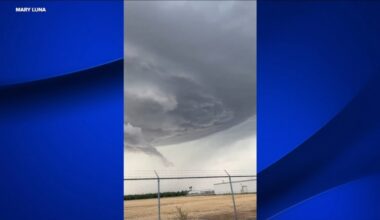 Lightning, funnel cloud captured above Valley sky