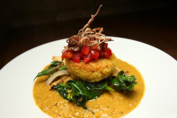 Pictured in this 2015 file photograph is the Red Lentil Lemongrass Coconut Curry, with Jasmine rice cake, Asian vegetables, kohlrabi, Blue Lake green beans, gai lan, anise glazed yuba, ginger-black bean oil, Thai basil, spicy plum, and shallot sambal at Millenium in Oakland, Calif. (Aric Crabb/Bay Area News Group)