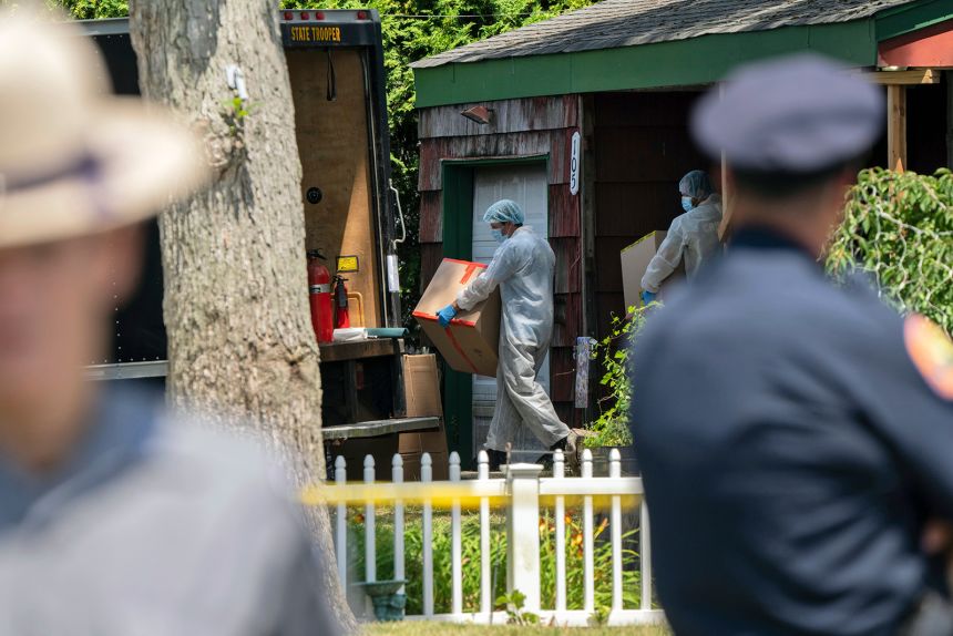 Crime laboratory officers removes boxes as law enforcement searches the home of Rex Heuermann, Saturday, July 15, 2023, in Massapequa Park, N.Y. Heuermann, a Long Island architect, was charged Friday, July 14, with murder in the deaths of three of the 11 victims in a long-unsolved string of killings known as the Gilgo Beach murders.
