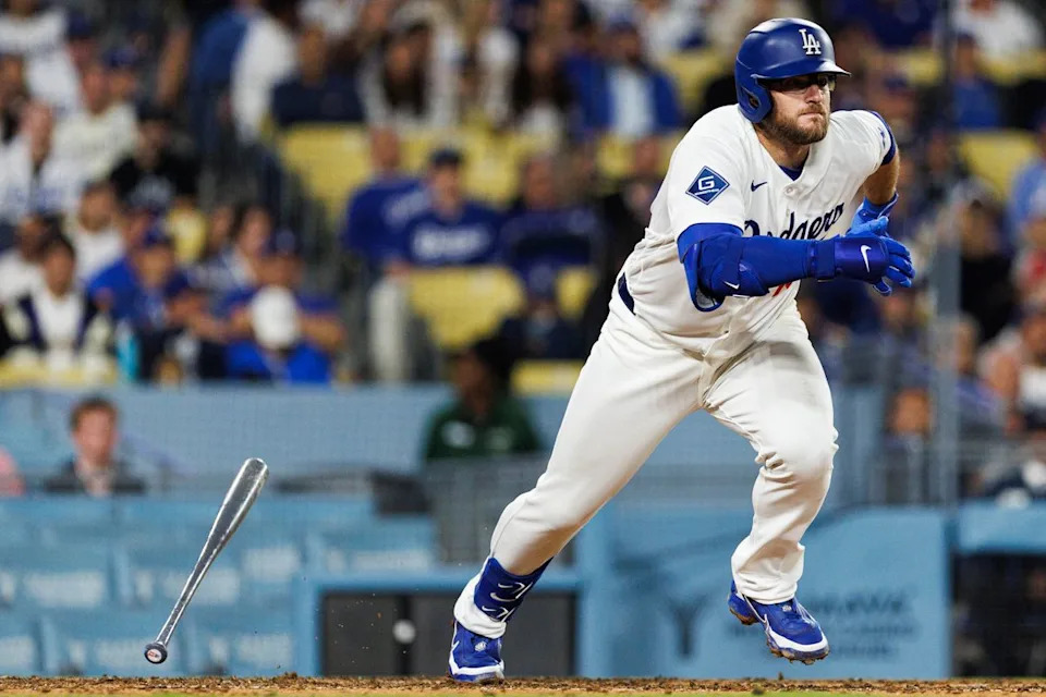 Max Muncy #13 of the Los Angeles Dodgers runs to first base during an MLB game against the Texas Rangers at Dodger Stadium on April 10, 2026 in Los Angeles, California.