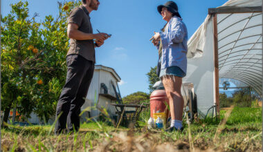 A reporter at the Long Beach Post, now part of The LA Local, interviews a resident in Long Beach, CA. Photo by Thomas R. Cordova.