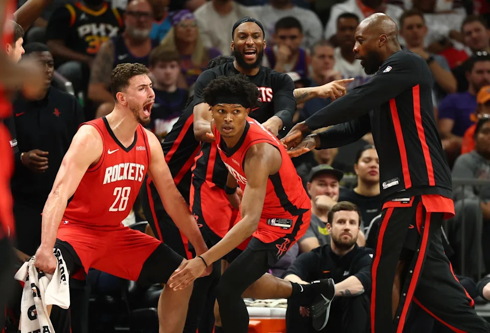Apr 7, 2026; Phoenix, Arizona, USA; Houston Rockets center Alperen Sengun (28) celebrates a shot by guard Amen Thompson (center) against the Phoenix Suns in the second half at Mortgage Matchup Center. Mandatory Credit: Mark J. Rebilas-Imagn Images