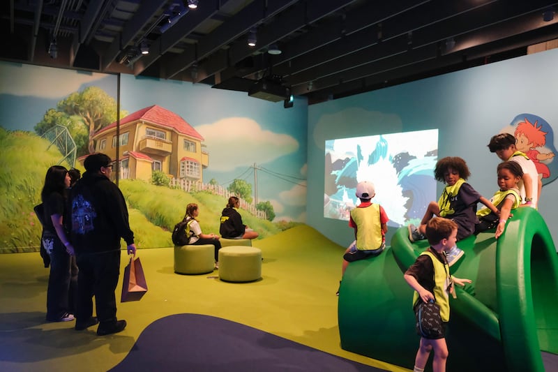 Children play on an interactive structure inspired by the world of "Ponyo."
