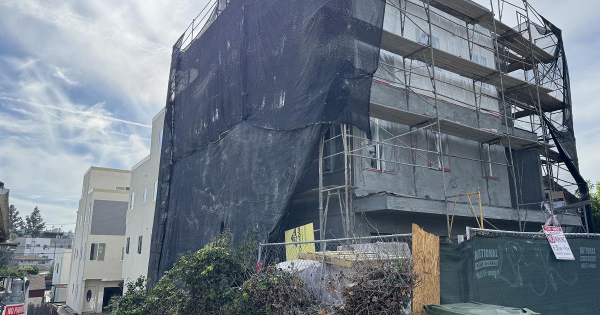 Three small house stake shape at 3120 Atwater Ave.