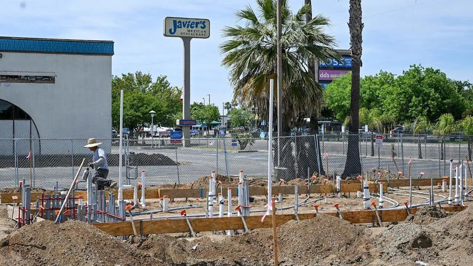 Workers begin construction on a new Dutch Bros Coffee going up near the old Javier's on Kings Canyon Road east of Clovis Avenue on Wednesday, April 15, 2026.