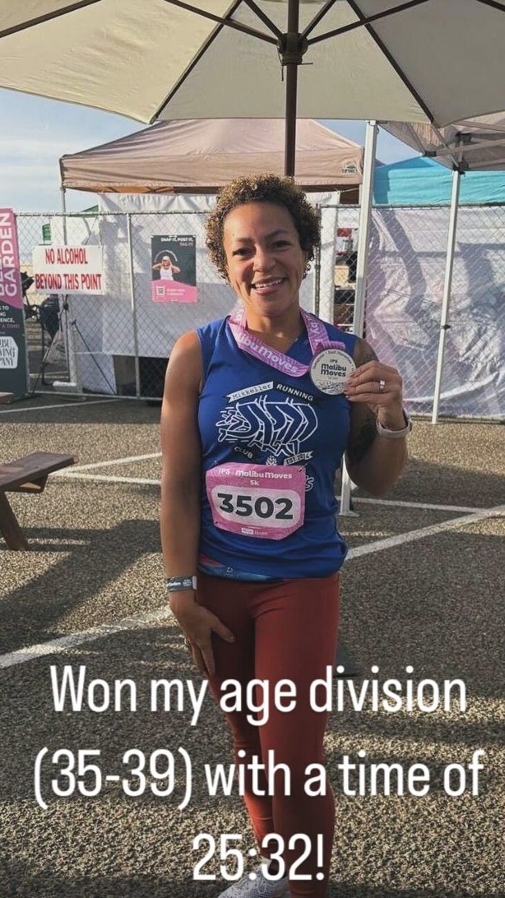 Nicole Holliday holds her finisher's medal at the Malibu Moves 5K. Image text: 'Won my age division (35-39) with a time of 25:32.'"