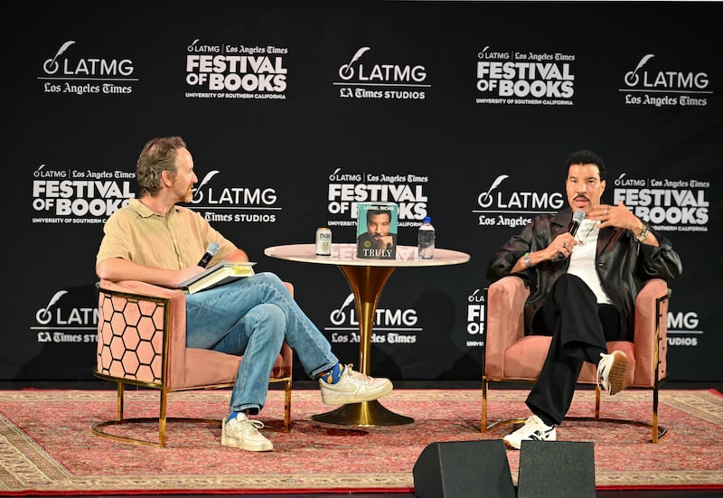 DESCRIBE THE IMAGE FOR ACCESSIBILITY, EXAMPLE: Photo of a chef putting red sauce onto an omelette.