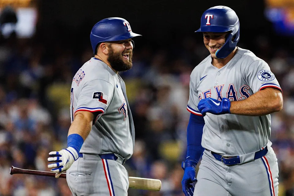Wyatt Langford #36 of the Texas Rangers celebrates after scoring a run during an MLB game against the Los Angeles Dodgers at Dodger Stadium on April 10, 2026 in Los Angeles, California.