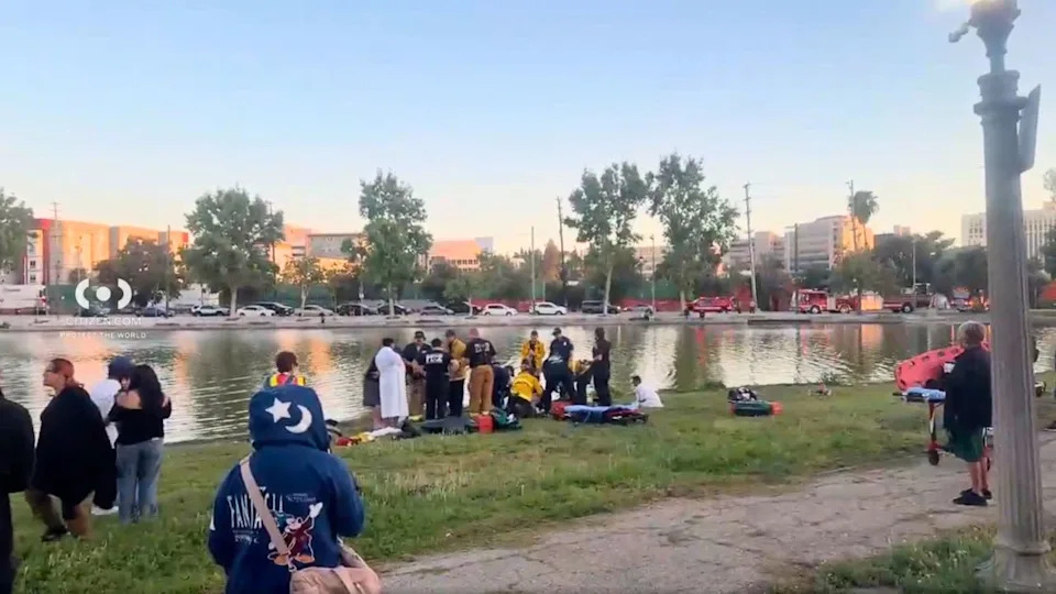 Firefighters and paramedics respond to a reported drowning at Lincoln Park in Lincoln Heights as rescue crews search the water and treat patients on shore.