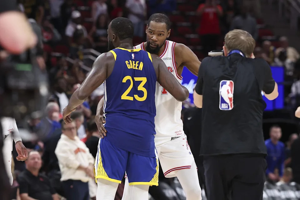 Mar 5, 2026; Houston, Texas, USA; Houston Rockets forward Kevin Durant (7) greets Golden State Warriors forward Draymond Green (23) on the court after the game at Toyota Center. Mandatory Credit: Troy Taormina-Imagn Images