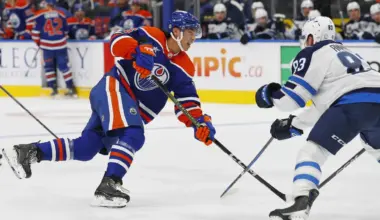 Edmonton Oilers forward William Nicholl (55) gets a shot away in front of Winnipeg Jets defensemen Dylan Anhorn (83) during the third period at Rogers Place.