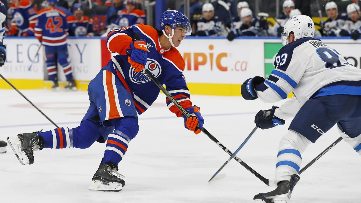 Edmonton Oilers forward William Nicholl (55) gets a shot away in front of Winnipeg Jets defensemen Dylan Anhorn (83) during the third period at Rogers Place.