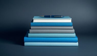 A photorealistic studio still life featuring a stack of hardcover books in shades of blue, gray, and white, with a single pen resting on top, conveying the abstract concepts of writing, publishing, and personal branding through clean, dramatic lighting and composition.