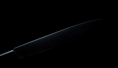 An extreme close-up of a knife blade reflecting a bright, harsh light, conceptually illustrating the violent nature of the recent stabbings in Fresno.