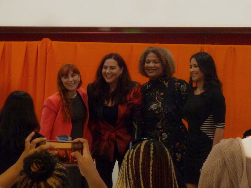 A panel of four women.