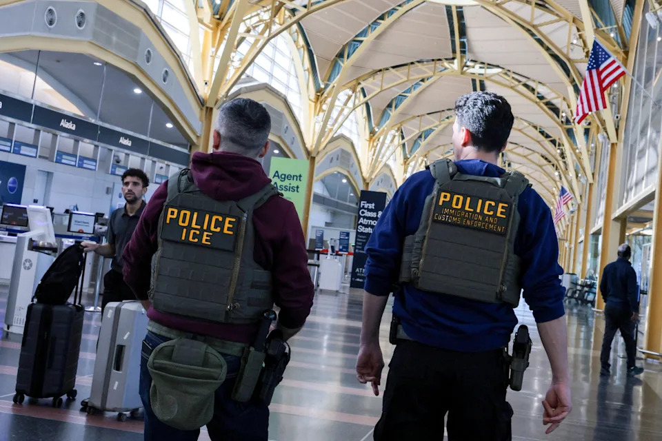 U.S. Immigration and Customs Enforcement (ICE) agents patrol at Washington Reagan National Airport in Arlington, Virginia, U.S., March 24, 2026.