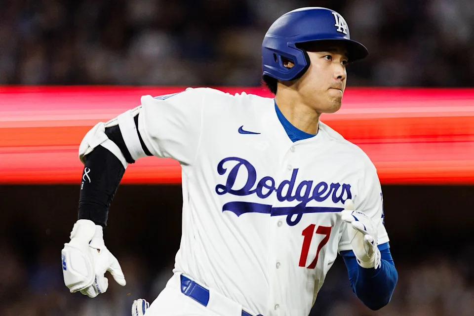 Shohei Ohtani #17 of the Los Angeles Dodgers runs to first base during an MLB game against the Texas Rangers at Dodger Stadium on April 10, 2026 in Los Angeles, California.