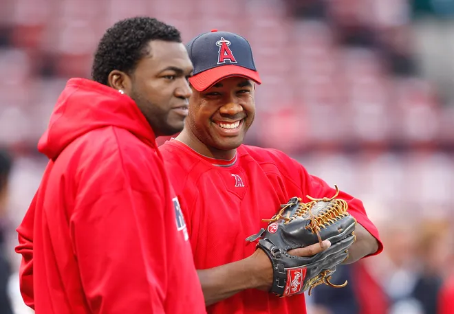 BOSTON - OCTOBER 5: Garret Anderson #16 of the Los Angeles Angels of Anaheim chats with the David Ortiz #34 of the Boston Red Sox before game three of the American League Division Series against Garret Anderson #the Los Angeles Angels of Anaheim at Fenway Park on October 5, 2008 in Boston, Massachusetts.