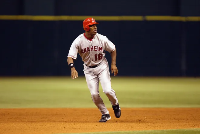 ST.PETERSBURG, FL - SEPTEMBER 5: Left fielder Garret Anderson #16 of the Anaheim Angels runs the bases against the Tampa Bay Devil Rays during the game on September 5, 2002 at Tropicana Field in St. Petersburg, Florida. The Angels defeated the Devil Rays 10-1.