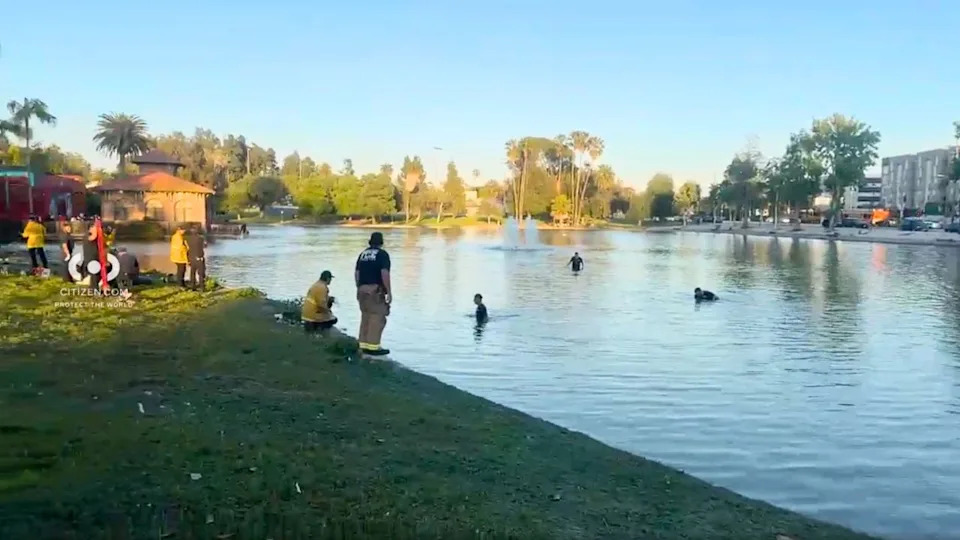 Firefighters and paramedics respond to a reported drowning at Lincoln Park in Lincoln Heights as rescue crews search the water and treat patients on shore.