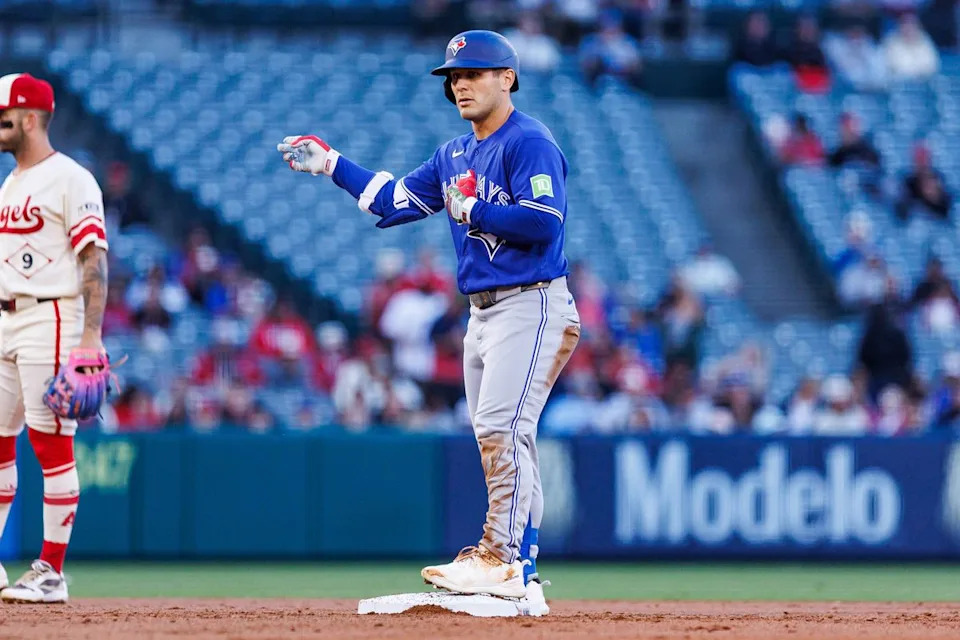 Daulton Varsho #5 of the Toronto Blue Jays celebrates after getting on base during an MLB game against the Los Angeles Angels at Angel Stadium on April 21, 2026 in Anaheim, California.