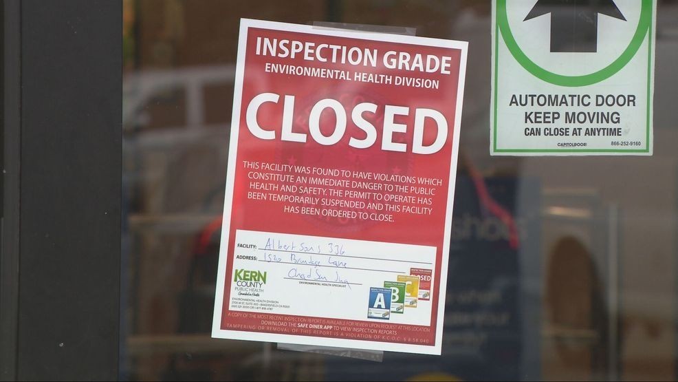 The Albertsons on Brundage Lane is closed, with signs on the window saying it was due to an inspection grade by Kern County Public Health and a power outage. PHOTO: KBAK/KBFX
