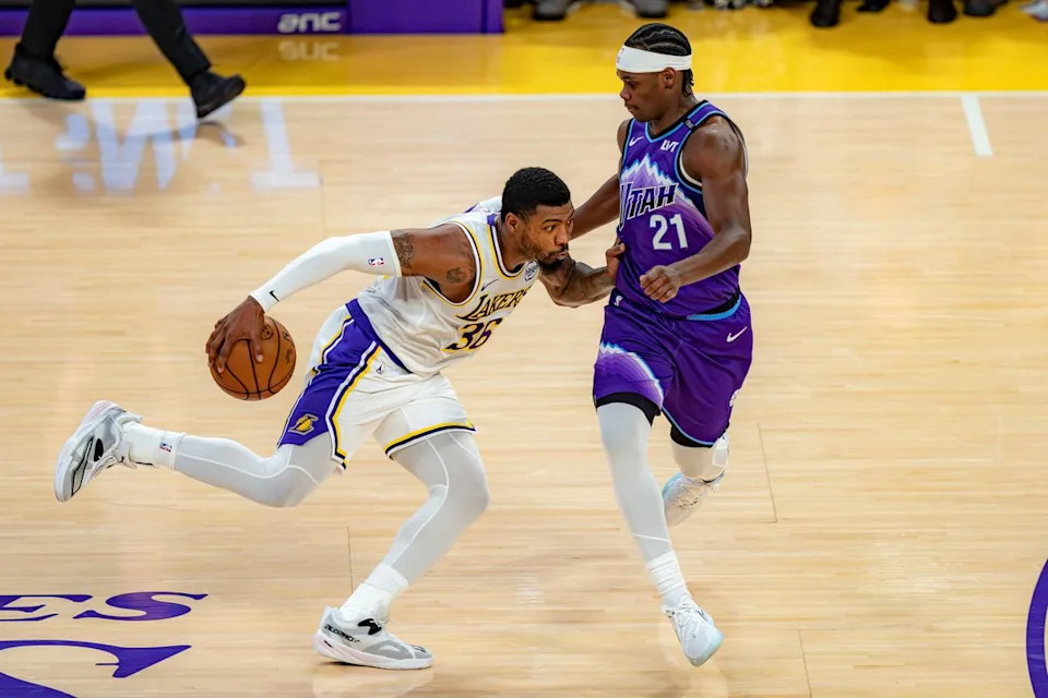 Los Angeles Lakers guard Marcus Smart (36) dribbling around Bez Mbeng (21) during an NBA basketball game against the Utah Jazz on April 12th, 2026 in Los Angeles, CA.