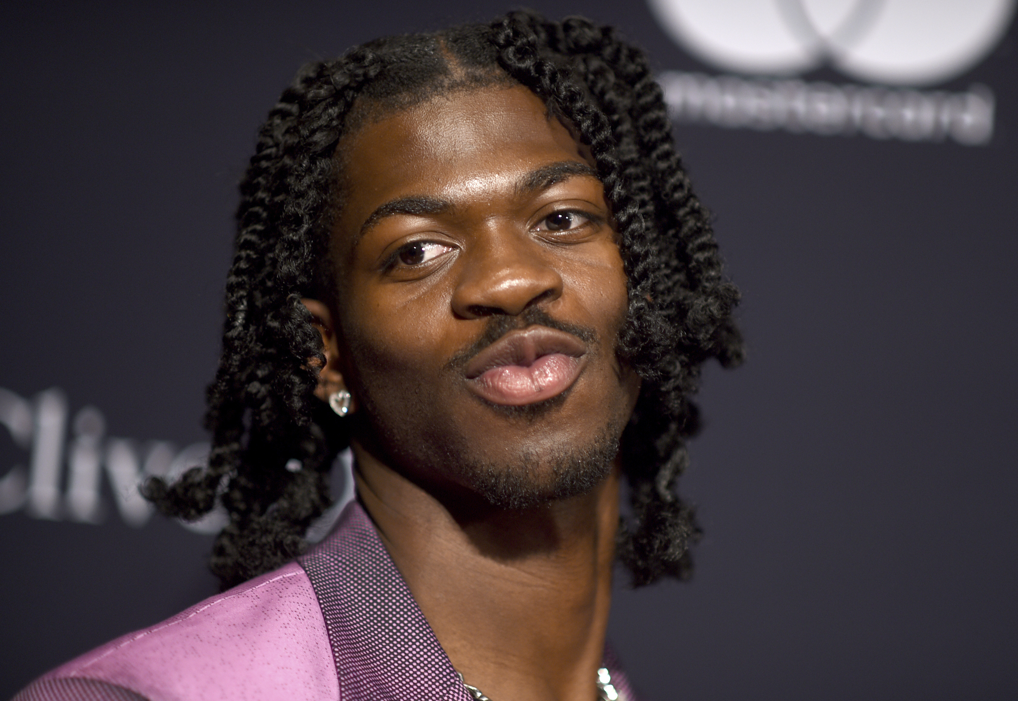 Lil Nas X arrives at the Pre-Grammy Gala on Saturday,...