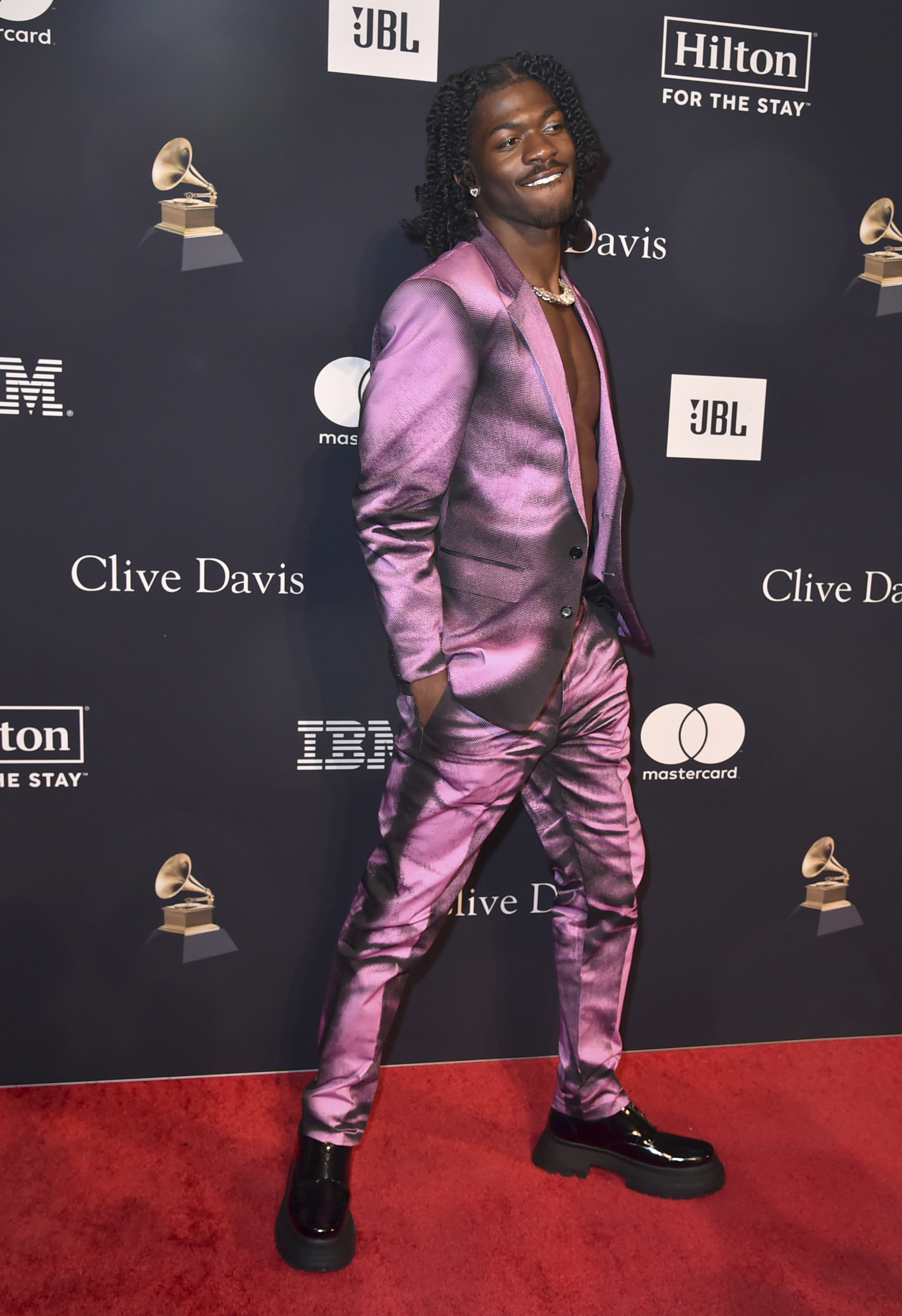 Lil Nas X arrives at the Pre-Grammy Gala on Saturday,...