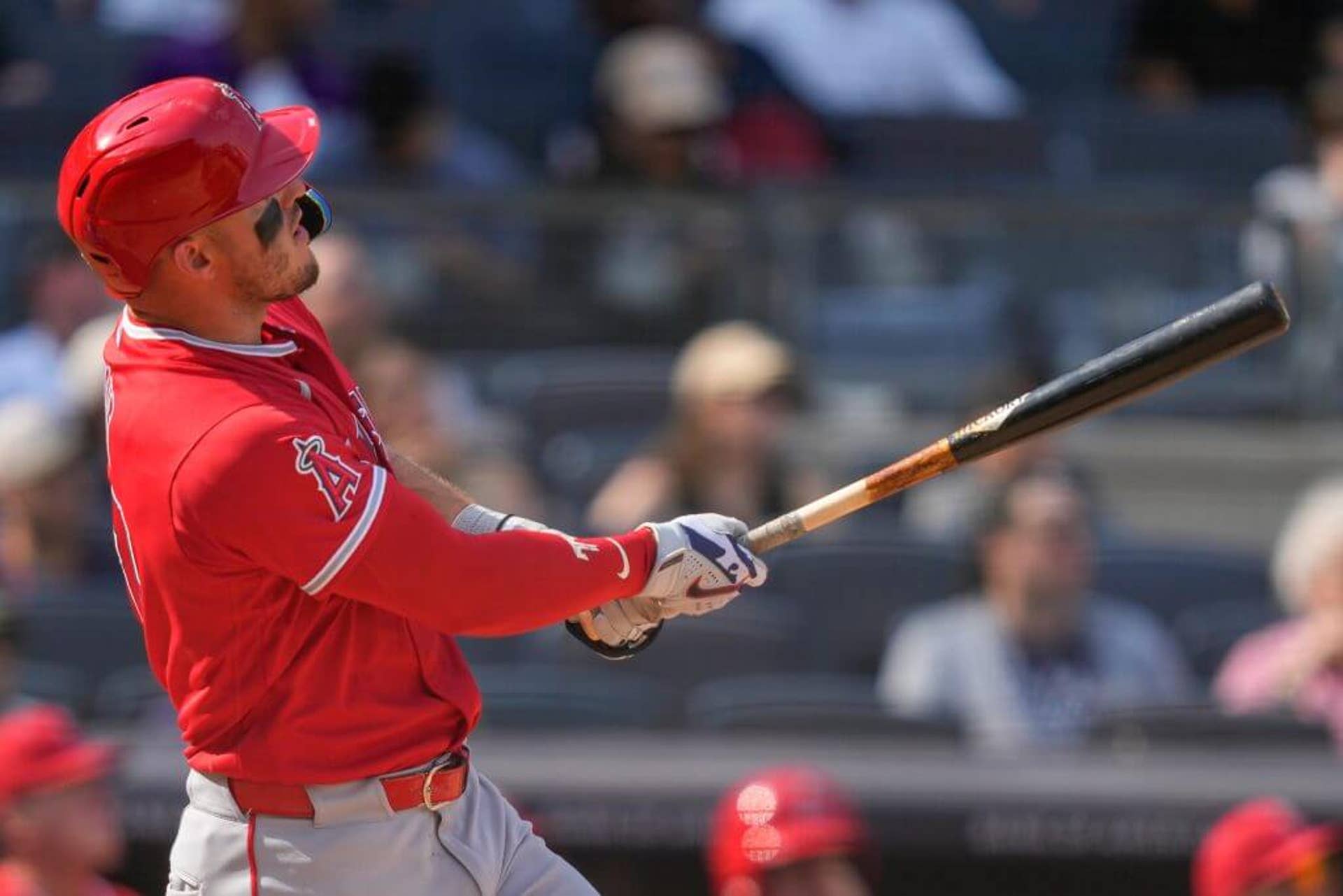 Mike Trout watches the ball after hitting a home run at Yankee Stadium.