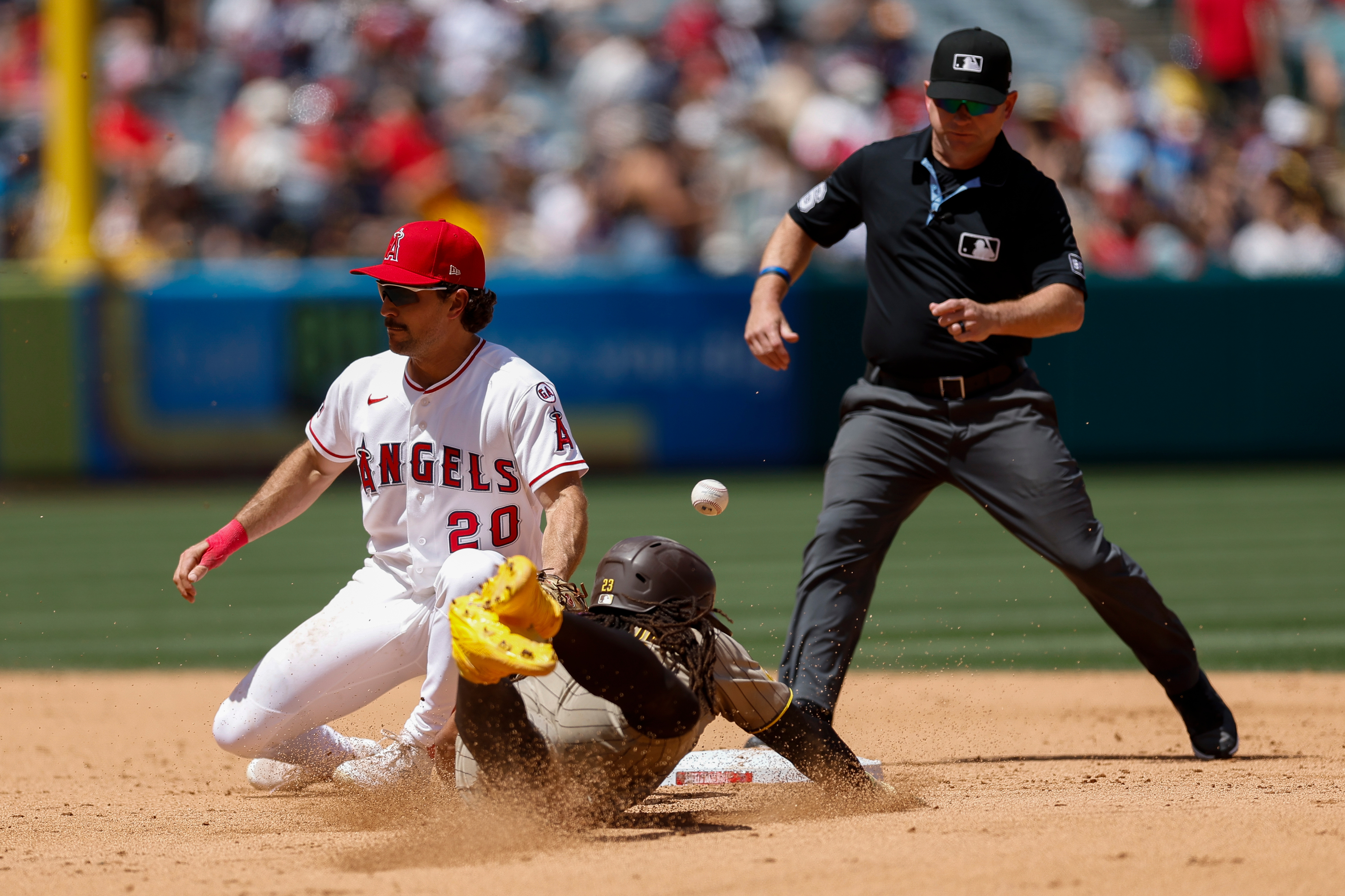 San Diego Padres’ Fernando Tatis Jr. (23) slides into second...