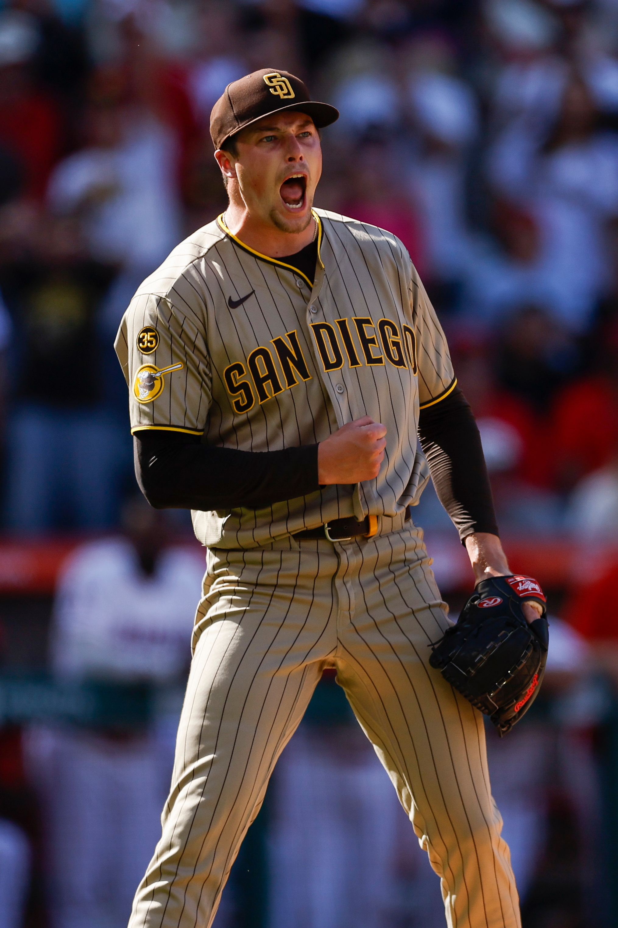San Diego Padres relief pitcher Mason Miller (22) reacts upon...