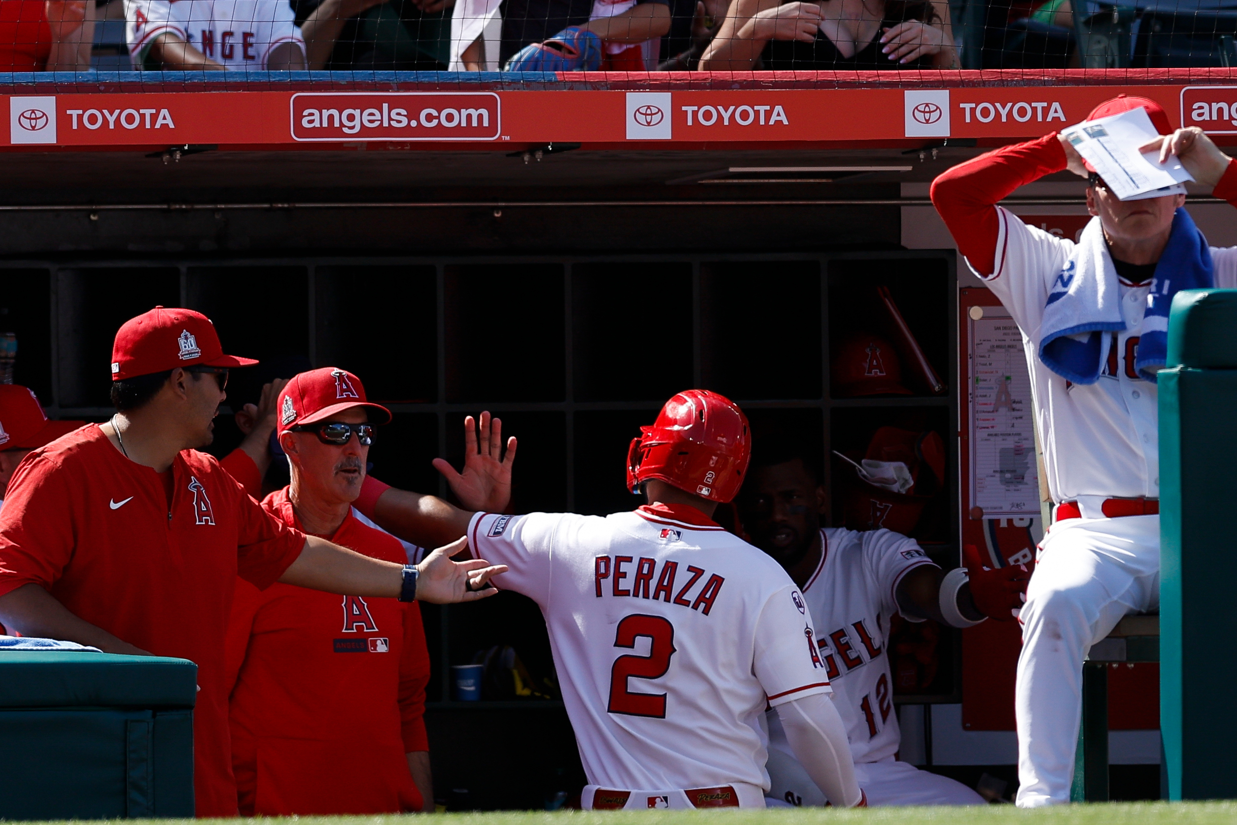 Los Angeles Angels third baseman Oswald Peraza (2) is greeted...