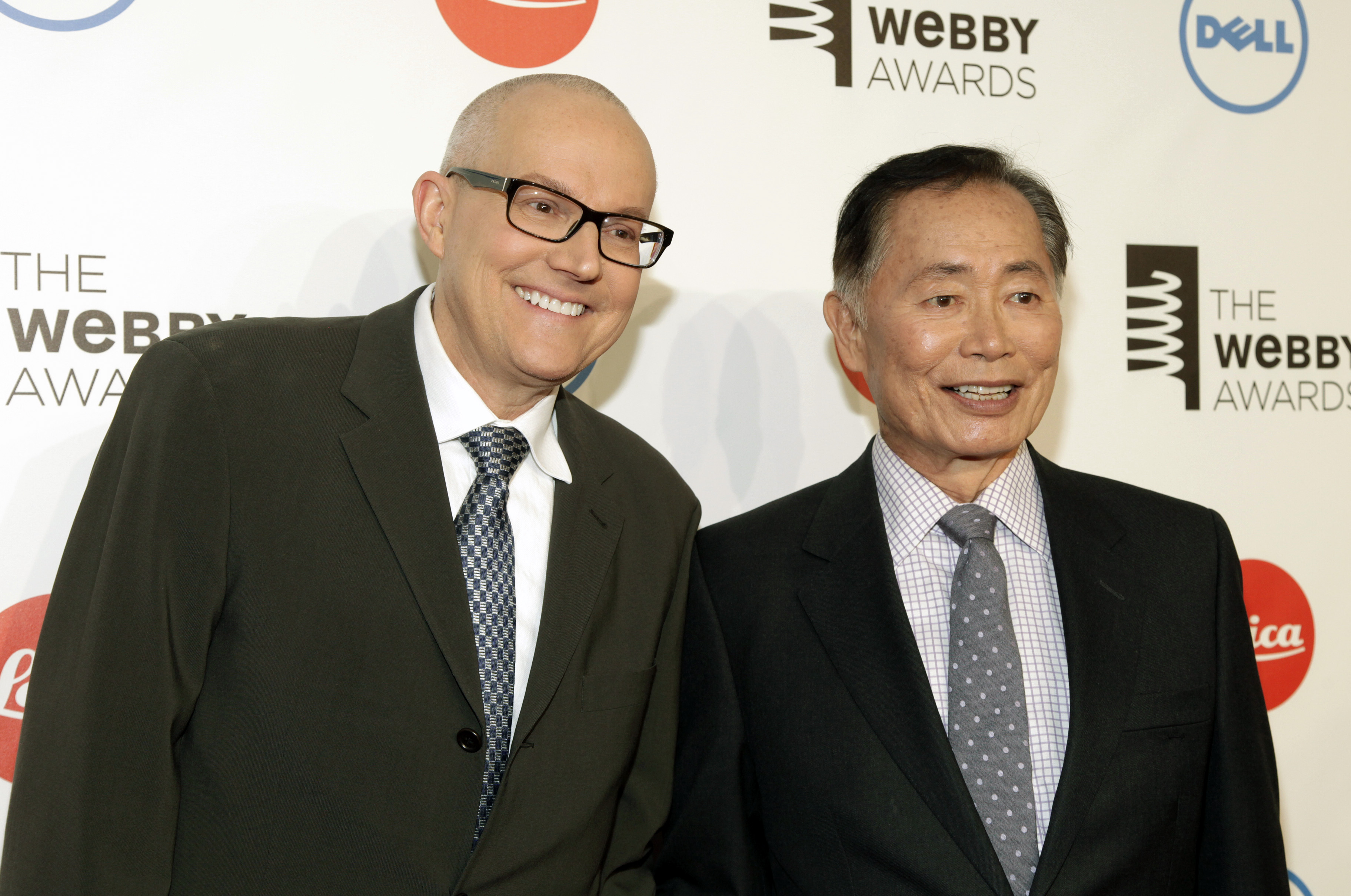 Actor George Takei, right, with husband Brad Altman, left, attends...