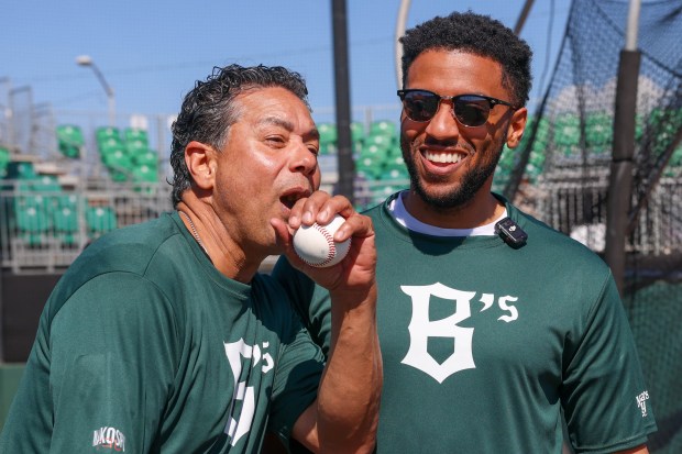 Oakland City Councilmember Ken Houston, left, and Oakland Interim Mayor Kevin Jenkins react after participating during the Oakland Ballers open tryouts at Raimondi Park in Oakland, Calif., on Saturday, March 8, 2025. (Ray Chavez/Bay Area News Group)