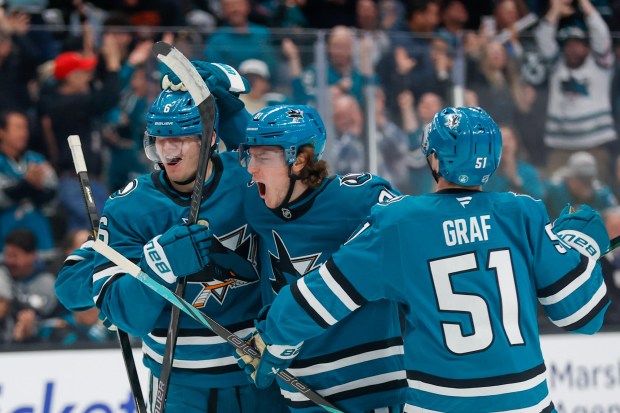 The San Jose Sharks celebrate a goal scored by San Jose Sharks' Sam Dickinson (6) against the Dallas Stars during the third period at SAP Center in San Jose, Calif., on Saturday, Jan. 10, 2026. (Shae Hammond/Bay Area News Group)
